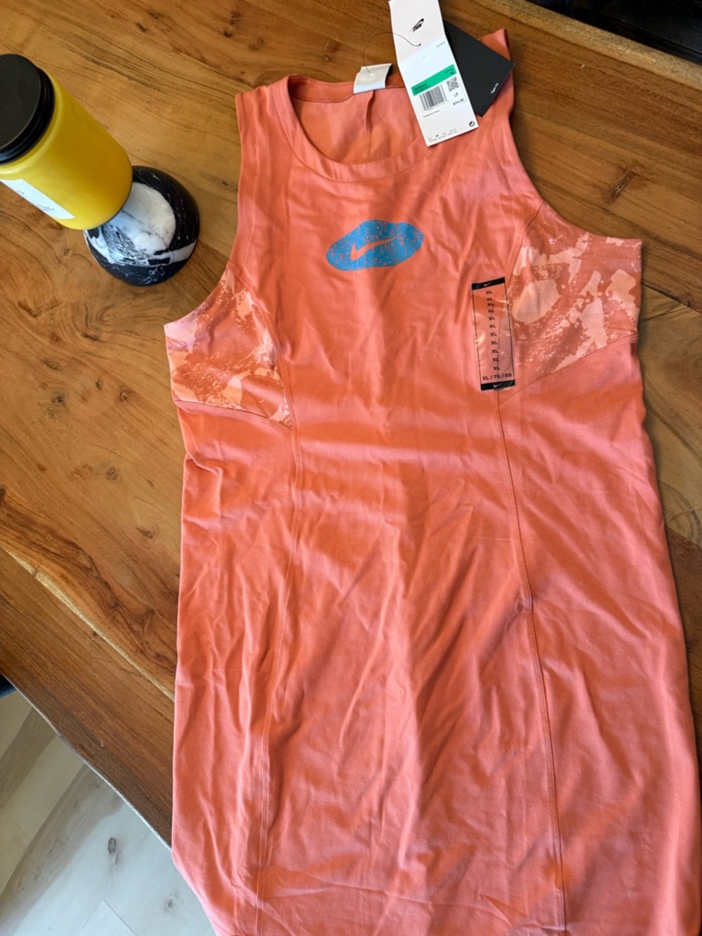 Nike Coral-Orange Sleeveless Training Tank with Blue Swoosh